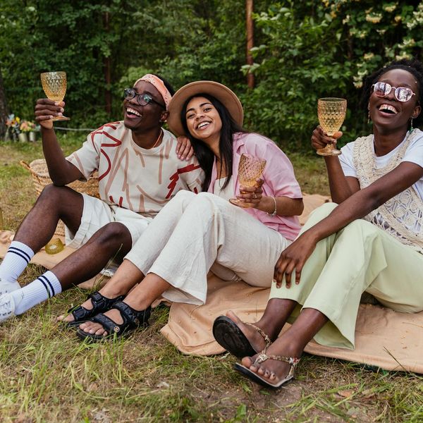 Diverse group of people smiling and looking relaxed.